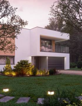 Luxury modern villa in the forest at dawn.